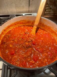 Simmering chili on the stove in a dutch oven