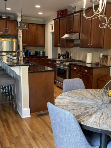 Contemporary kitchen with wooden cabinets and stainless steel appliances.