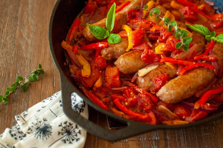 Italian Sausage with Bell Peppers, onions & tomatoes in a cast iron