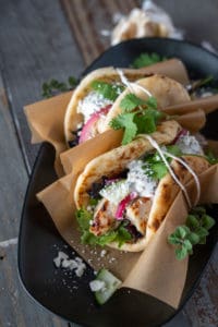 Greek Chicken pita with tazitiki and feta wrapped with string