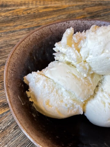 Three scoops of Vanilla bean ice cream in a bowl