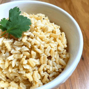 Cooked Light brown rice bella brand with cilantro on top