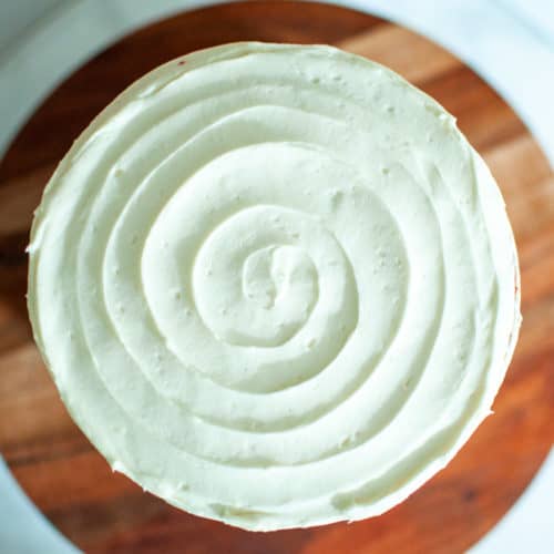 Smooth spiral frosting on a cake, spread with an offset spatula