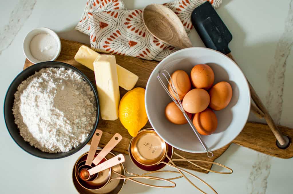 Eggs flour lemon butter on cutting board