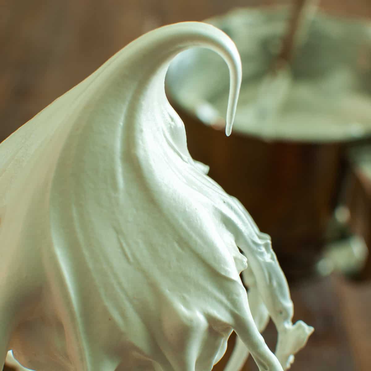 Meringue Frosting on a Whisk with a soft peak