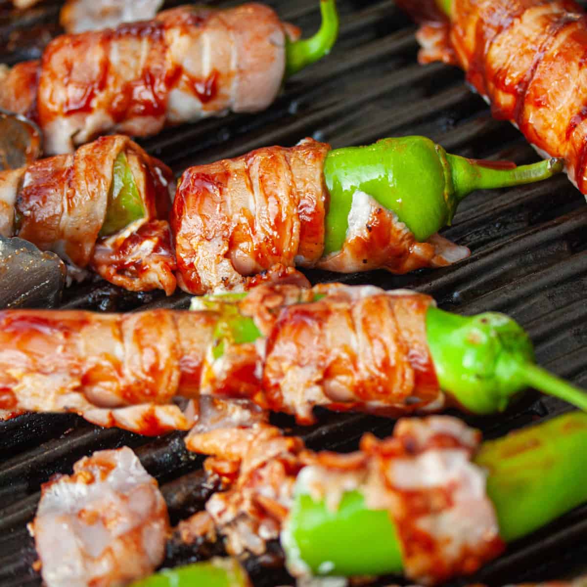 hatch peppers wrapped in bacon with BBQ sauce