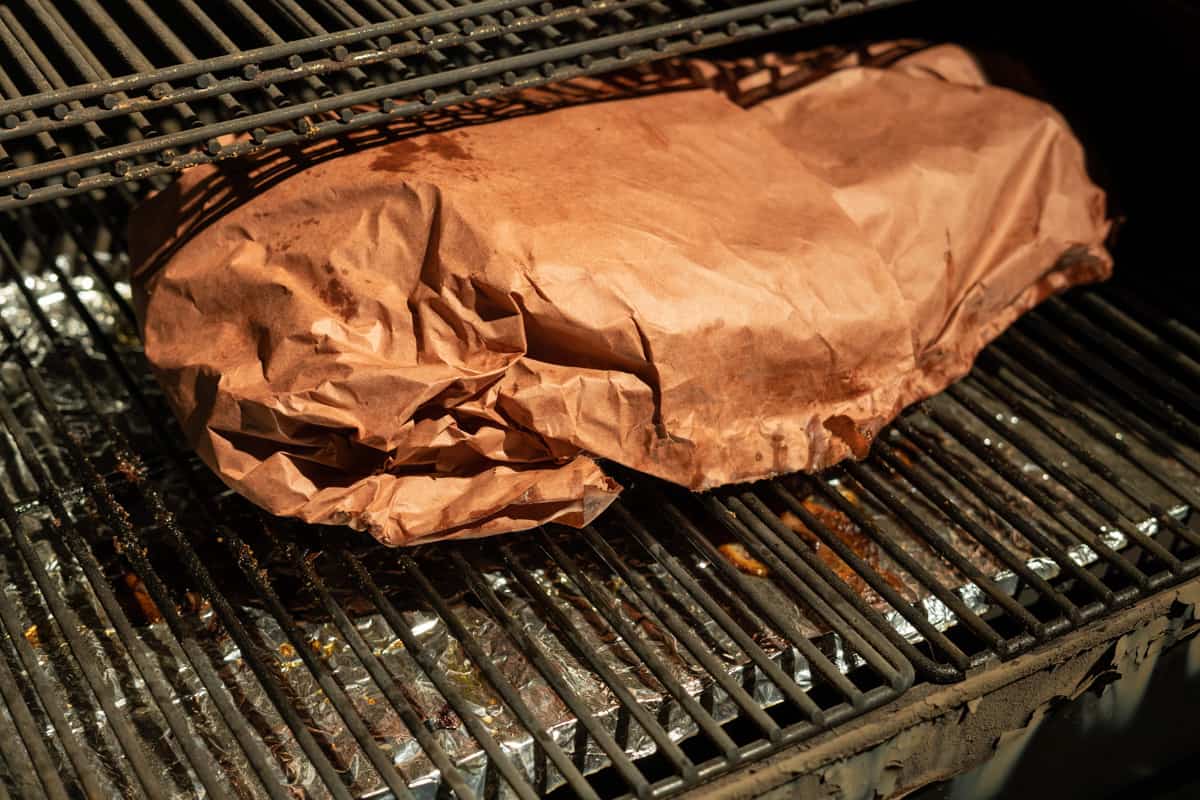 brisket on a pellet smoker that has been wrapped in butcher paper