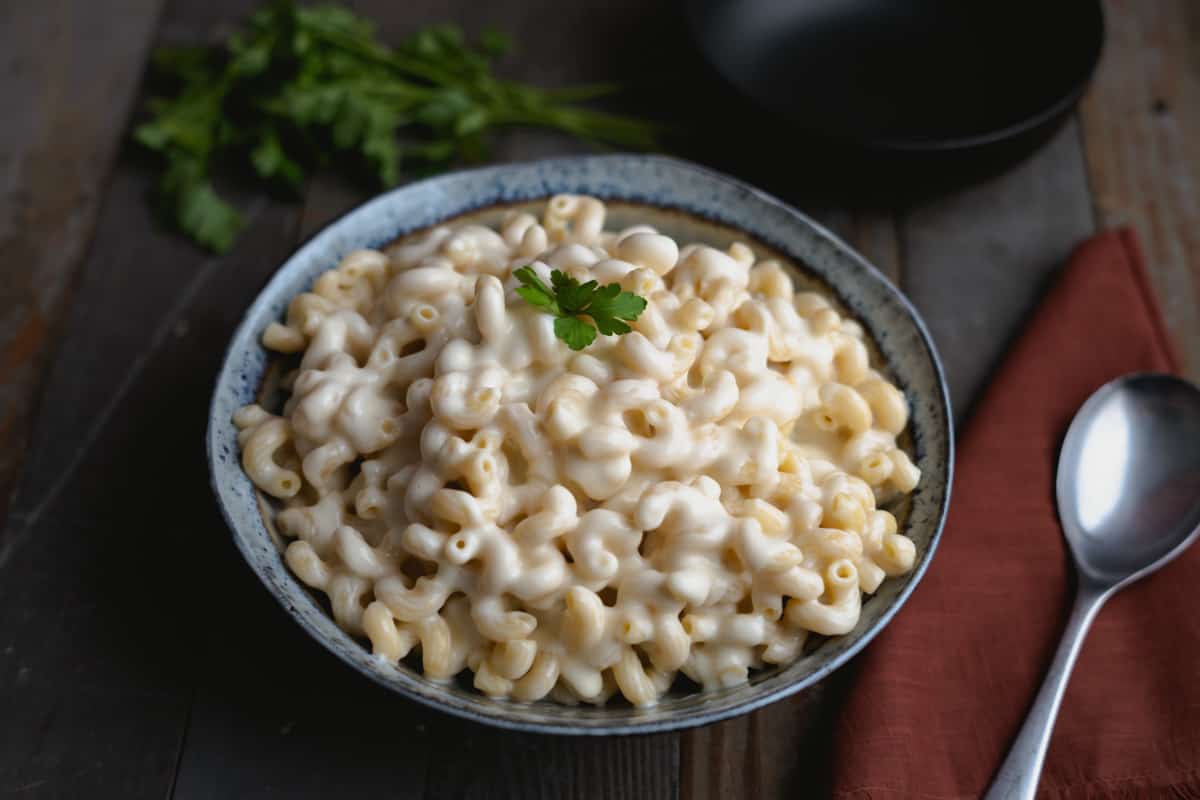 smoked gouda mac and cheese in a bowl with corkscrew noodles