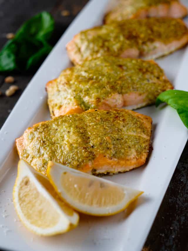 Pesto Salmon on a Platter with Lemon Wedges