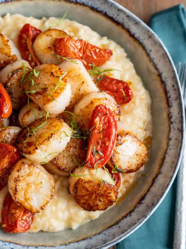 Seared Scallops on Truffle Risotto in a Bowl on a Table