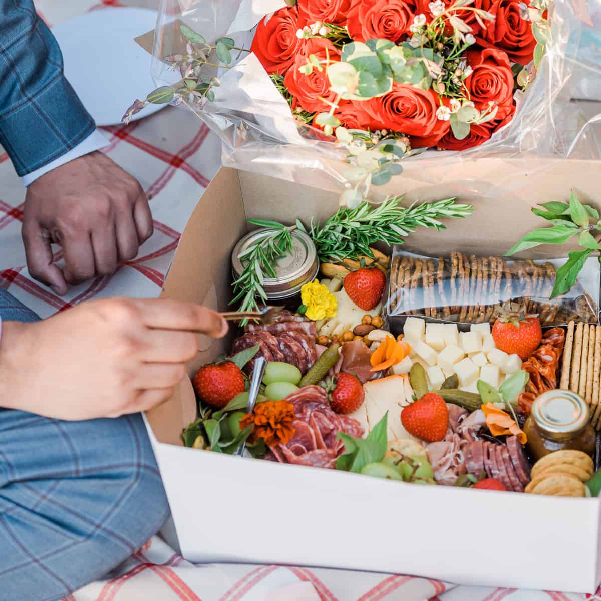 charcuterie in a disposable white cake box