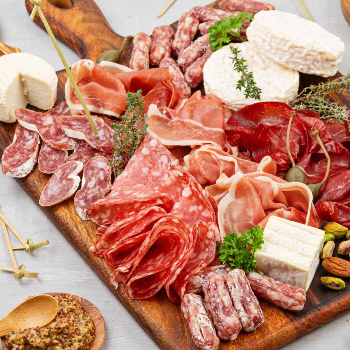 Small square charcuterie board with meats and cheese