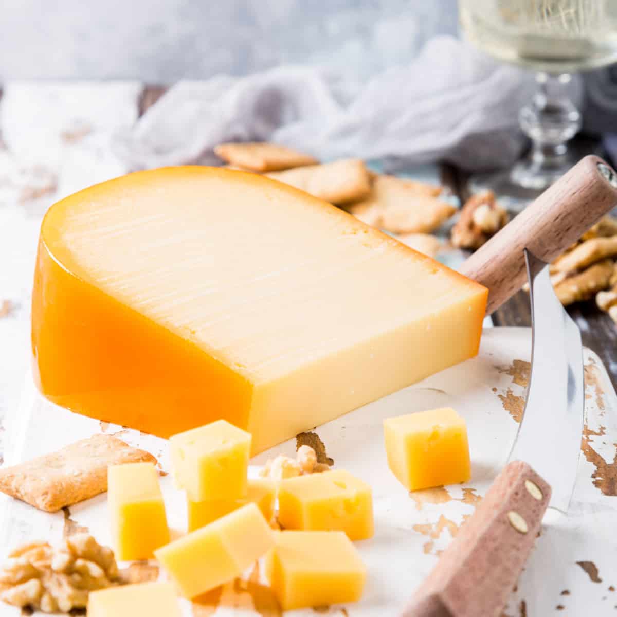 wedge of gouda cheese with cubes cut 