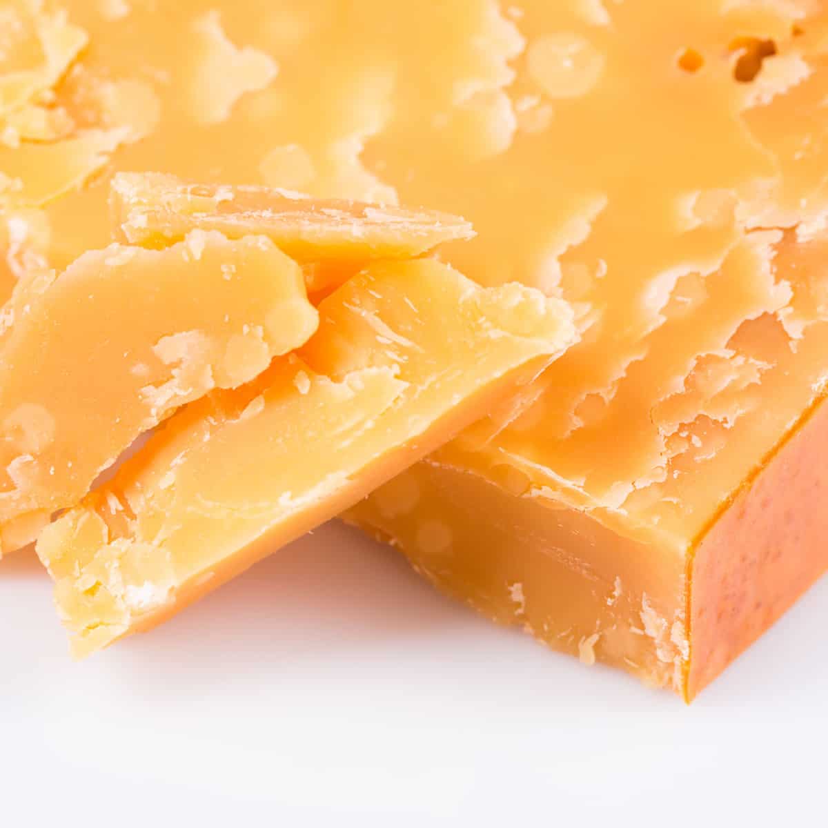 up close of aged gouda highlighting the natural crystal formation