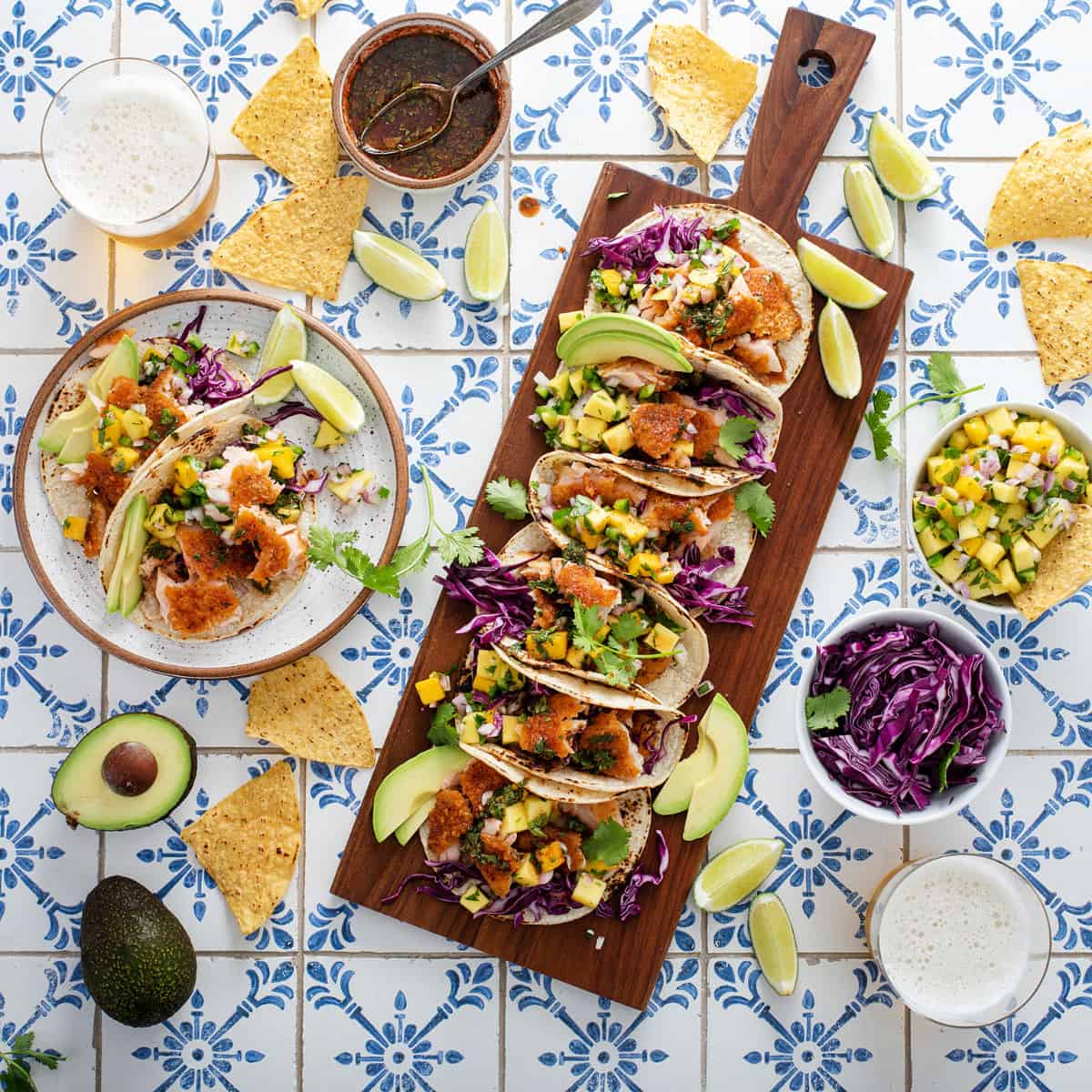 Rectangular charcuterie style board covered in tacos