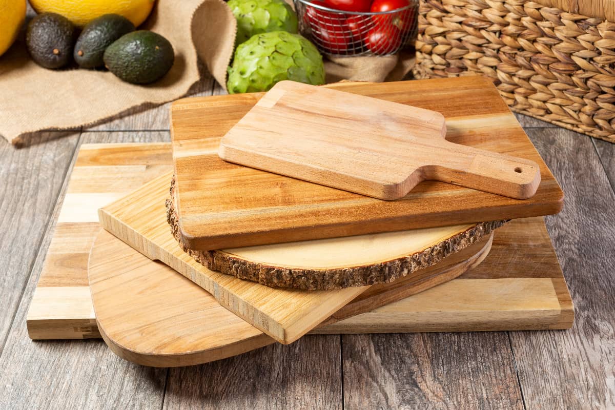 a mix of Charcuterie and cutting boards stacked on top of each other