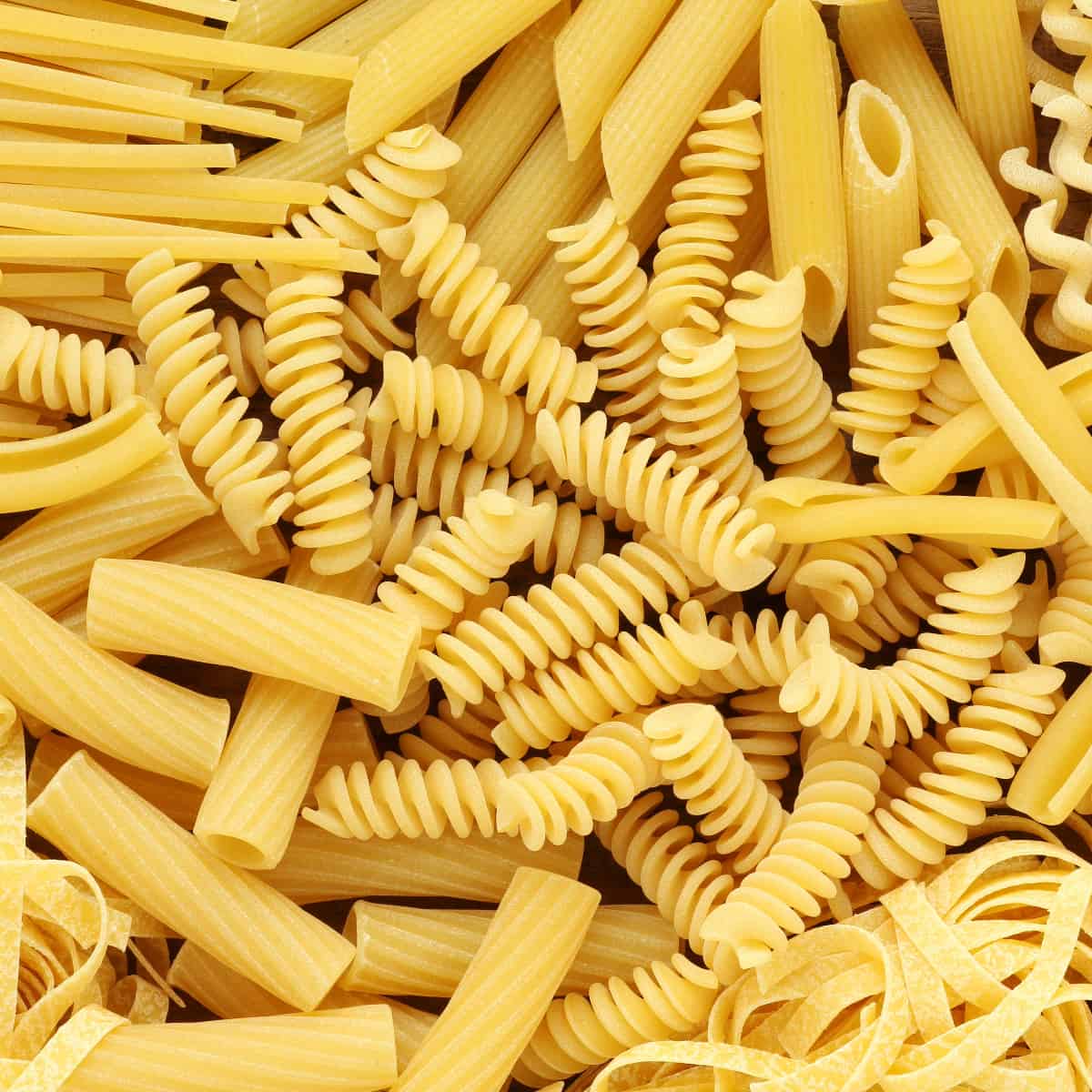 an up-close view of multiple dry pasta varieties