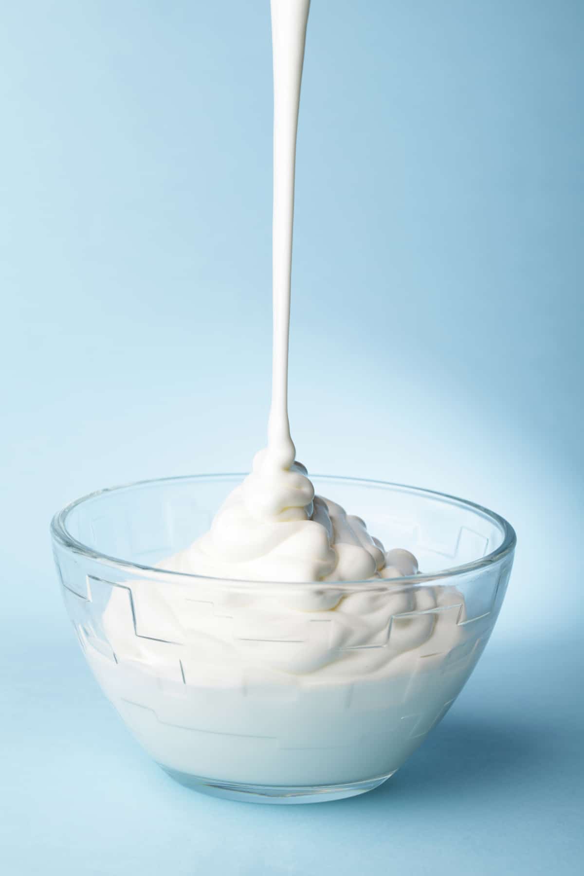 Mexican Crema being drizzled into a bowl 