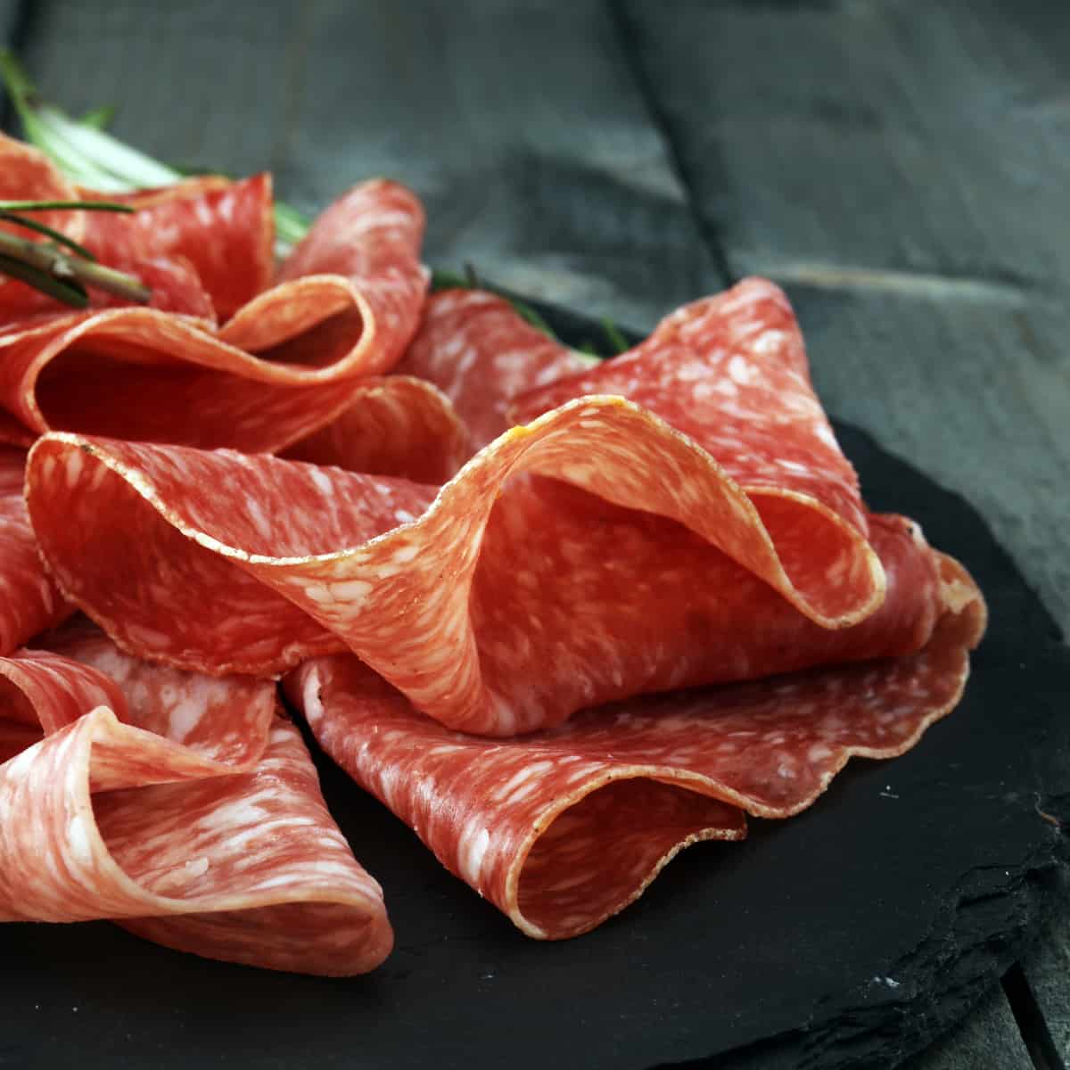 an up close view of thin sliced salami