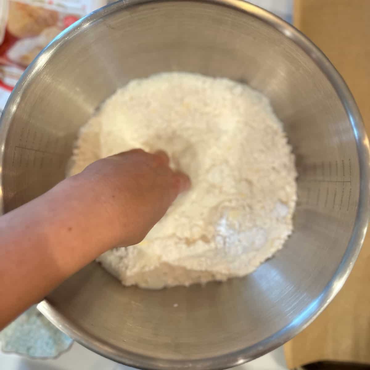 mixing biscuit dough by hand