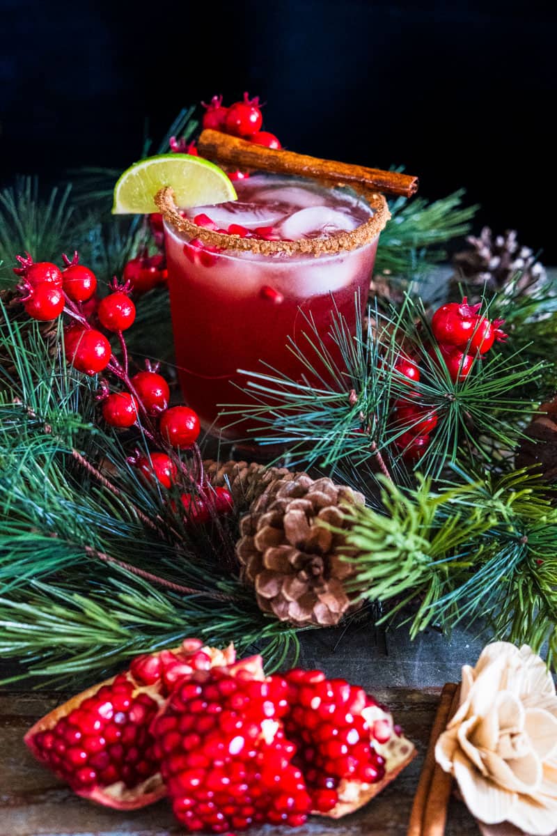 Pomegranate Margarita in wreath with fresh pomegranate on a table