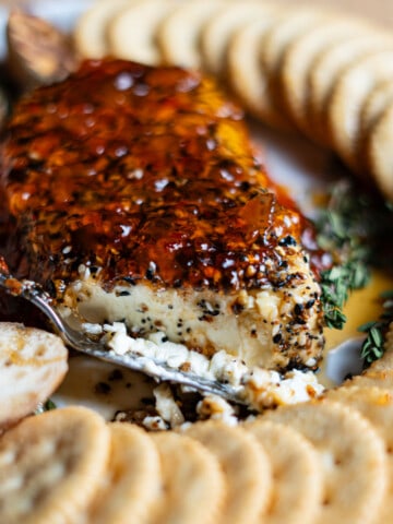 block of smoked cream cheese surrounded by crackers